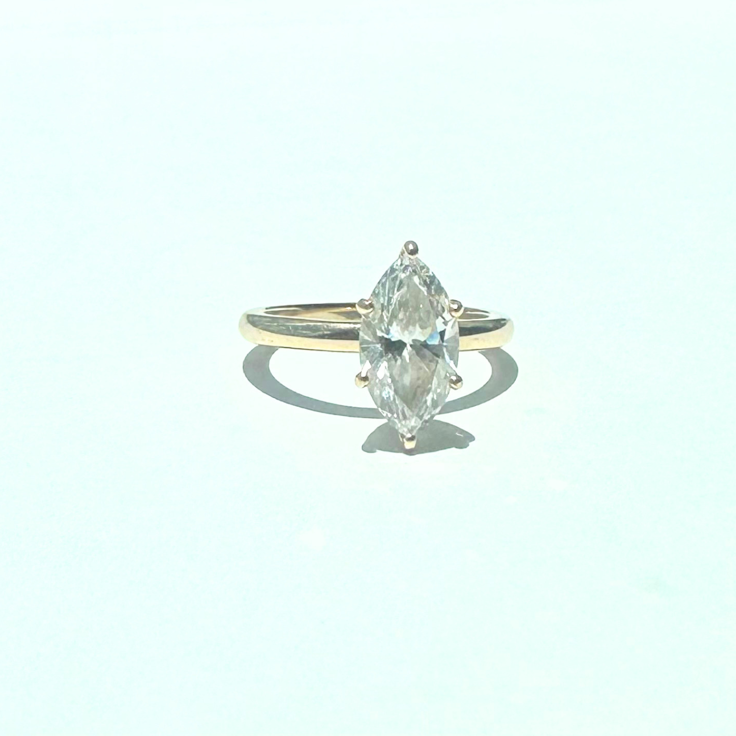 Marquise lab diamond engagement ring in yellow gold