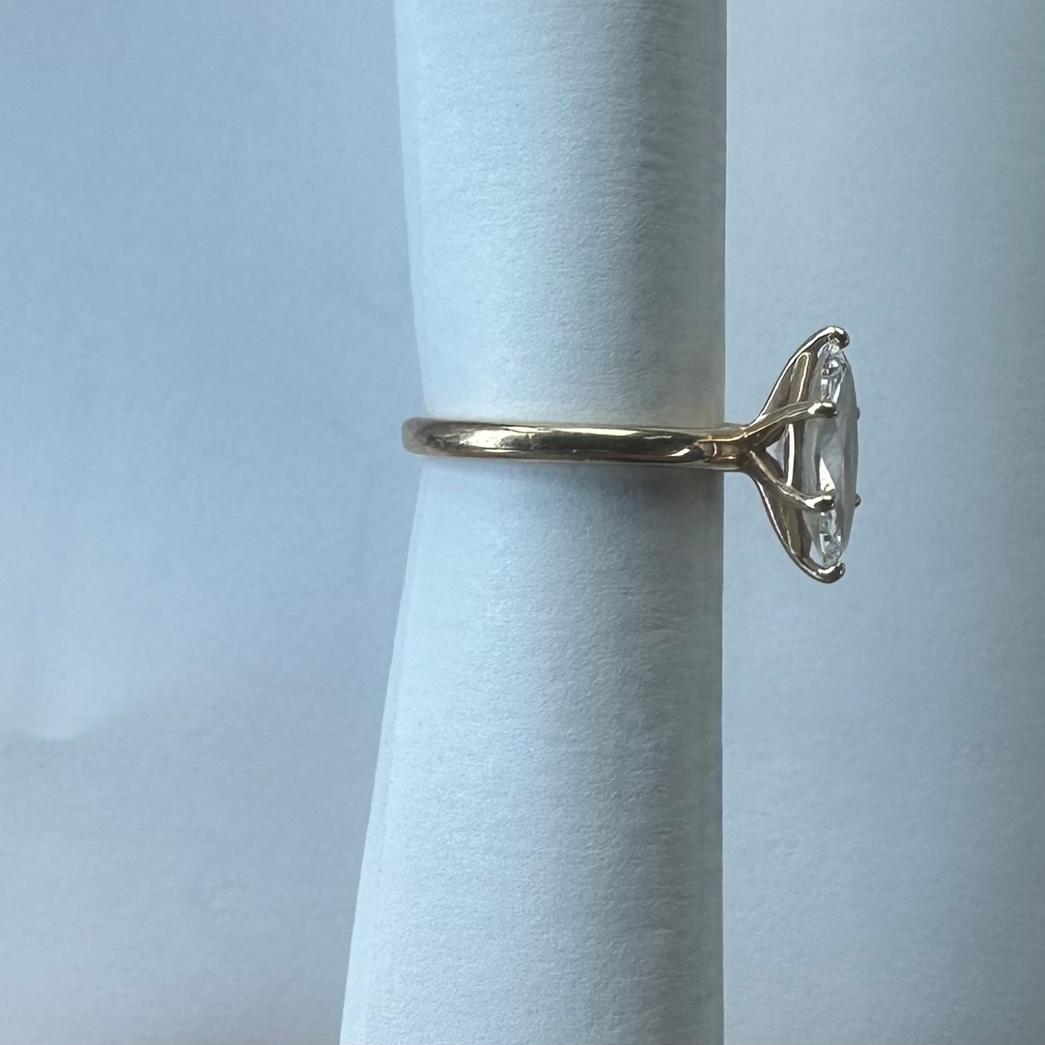side view of preowned marquise lab diamond soliatire ring