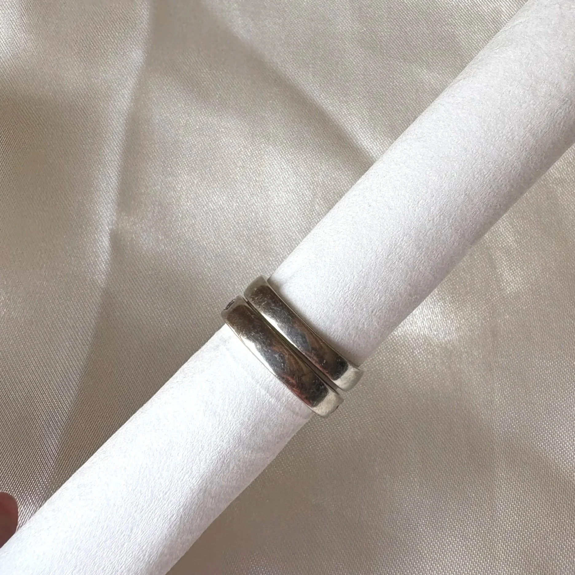 View of rear side of wedding band and engagement ring in white gold