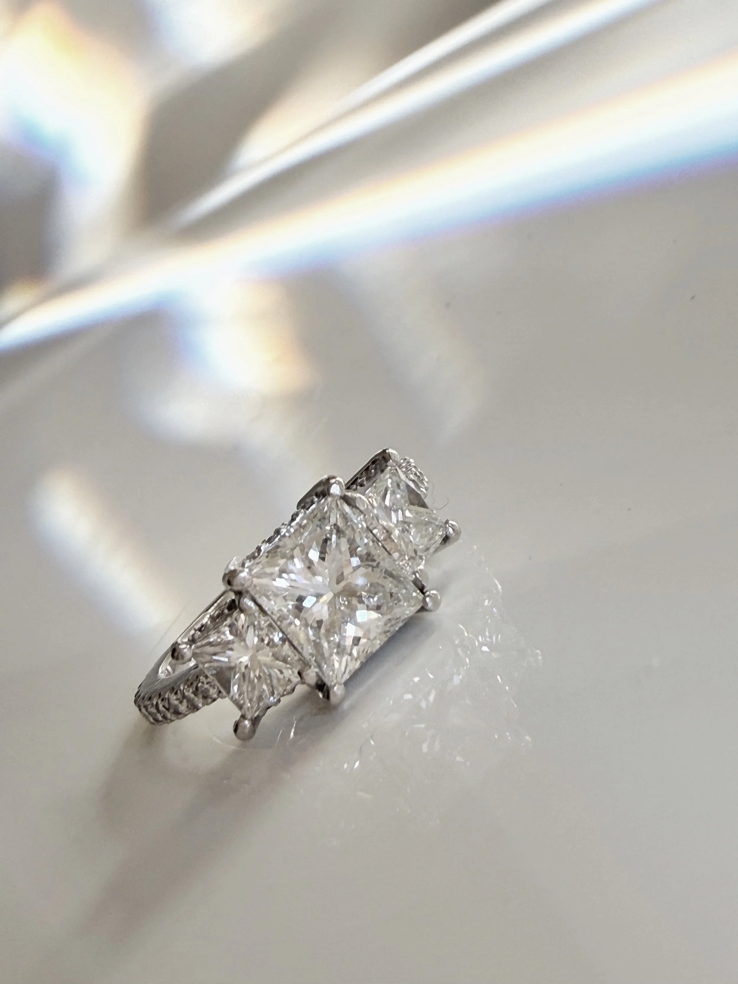 Preloved diamond engagement ring, 1.98 carats, three stones, princess cut