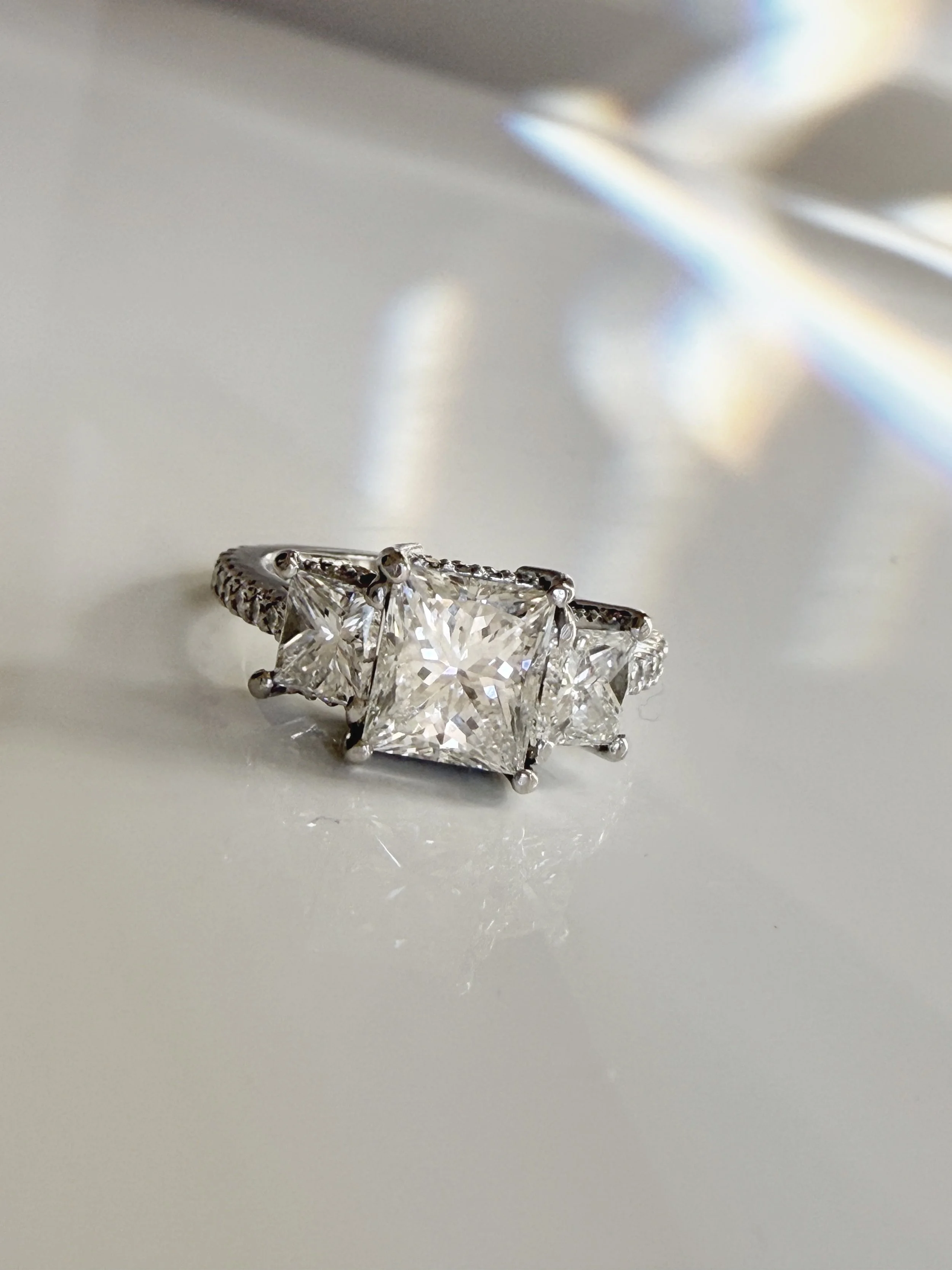 Preloved diamond engagement ring, 1.98 carats, three stones, princess cut