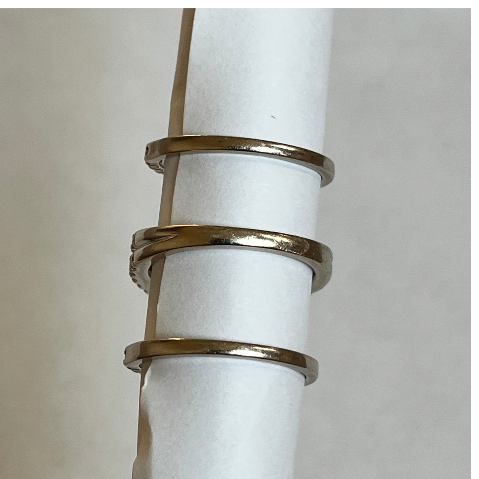 back view of 3 white gold secondhand rings