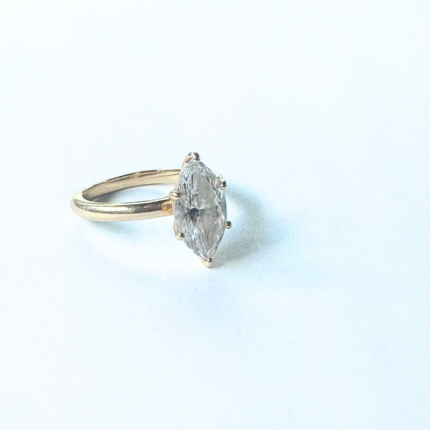 Preloved marquise-cut solitaire engagement ring quarter view