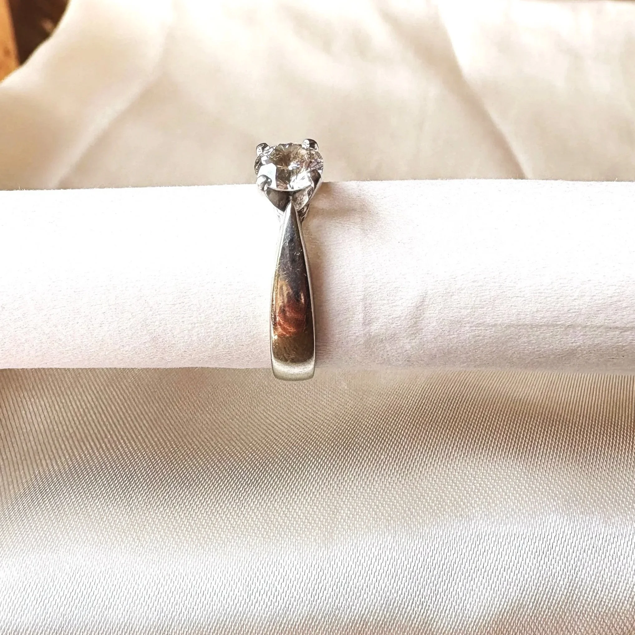 side view of preowned solitaire round engagement ring