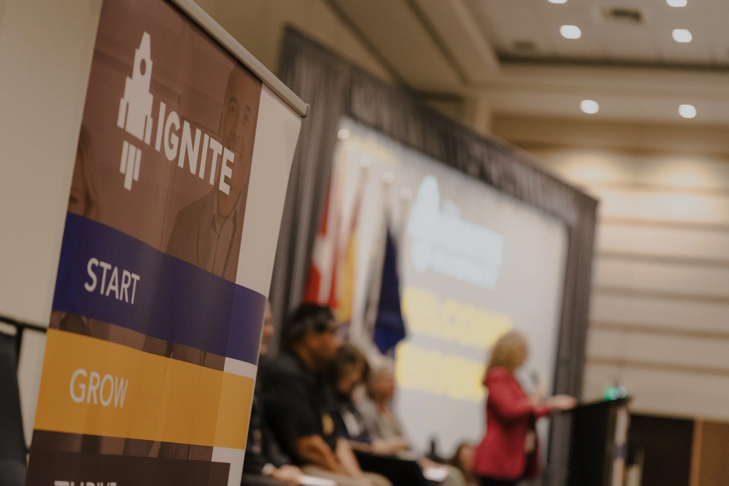 Ignite Summit 2025_Paula at Podium 6.jpg