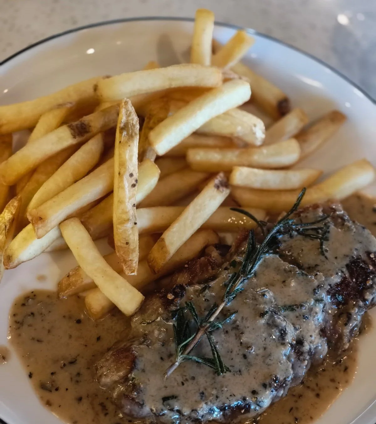 Steak and Fries with black peppercorn sauce.jpeg