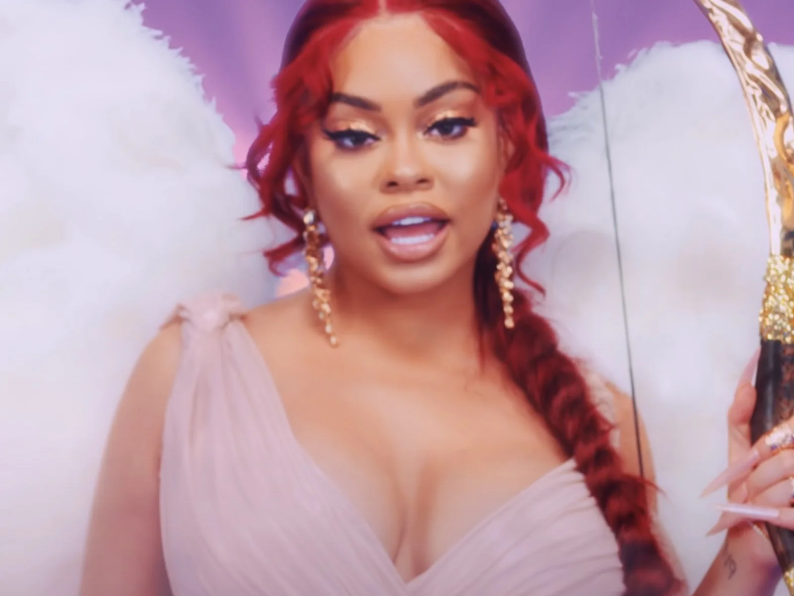 Latto is ridiculously slaying going with the olive green flex