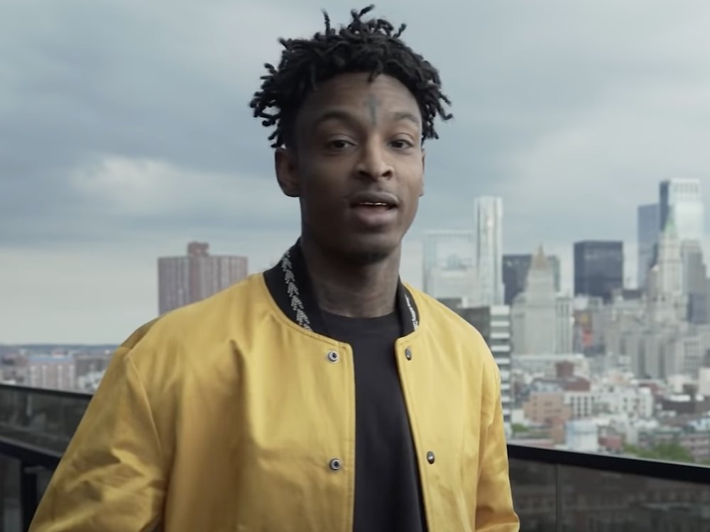 21 Savage's is all smiles in a Louis Vuitton Chargers fit — Attack