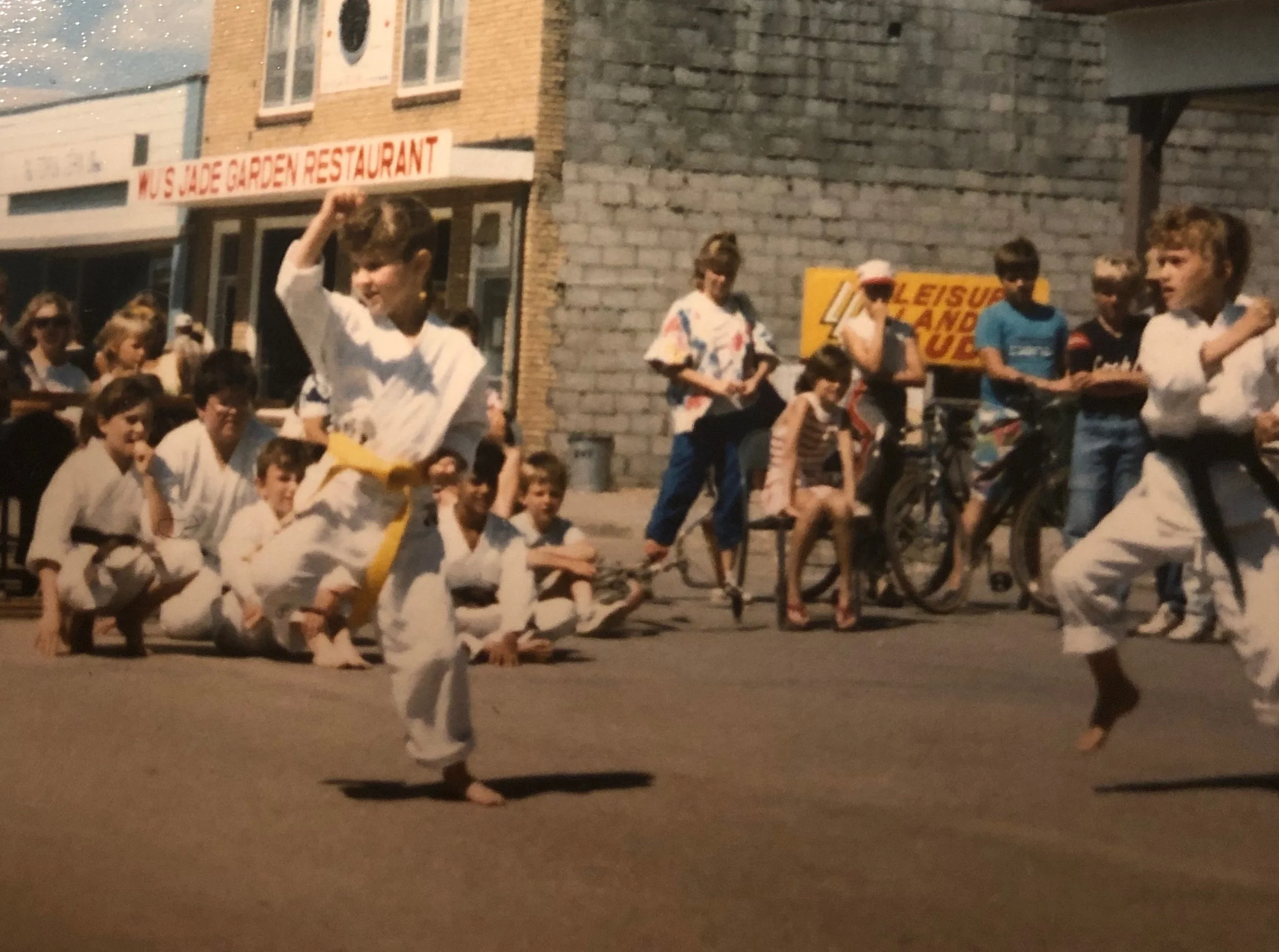 Young Angela Performing Karate in the Street.