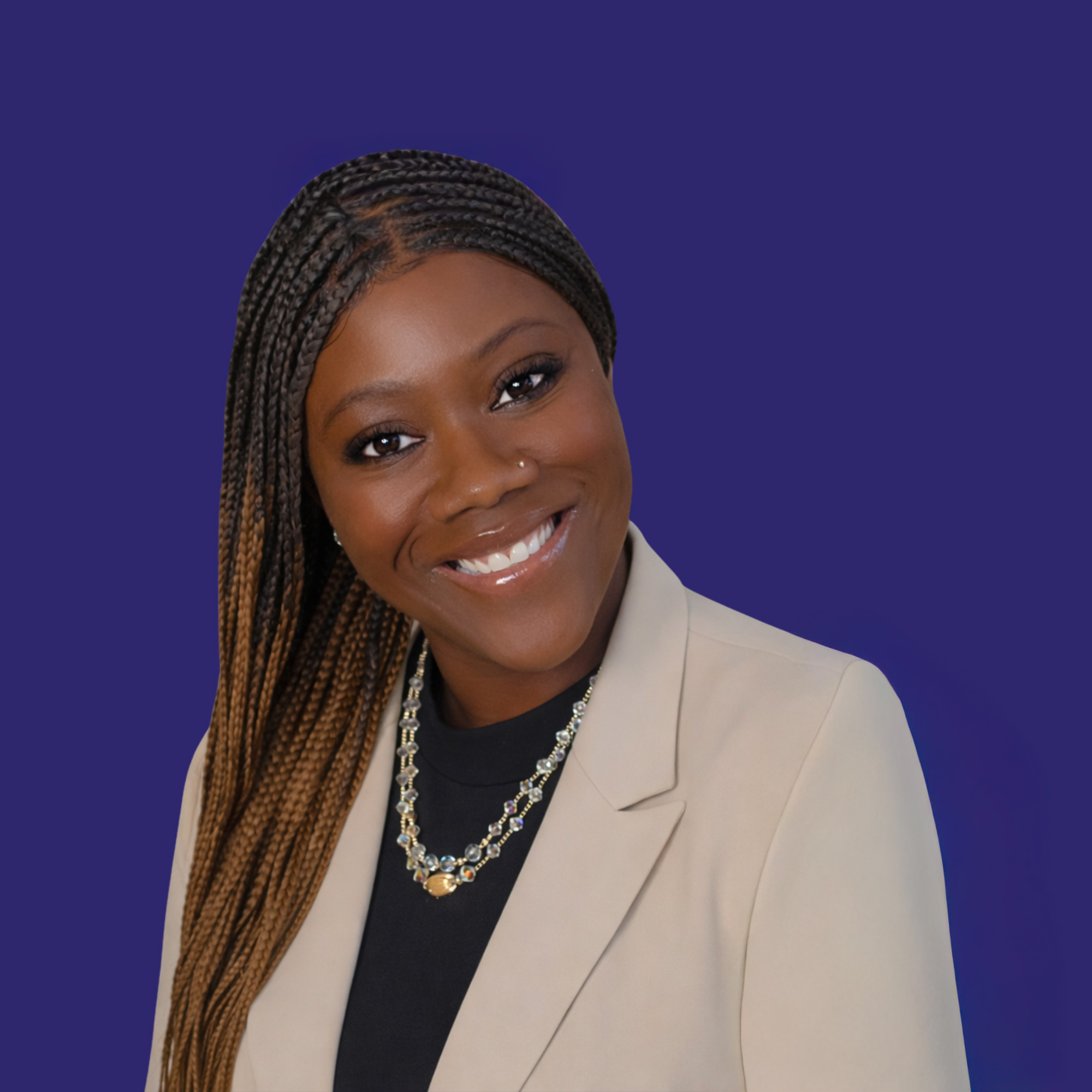 A woman wearing glasses, gold jewelry, and a pink top, smiling against a dark blue circular background.