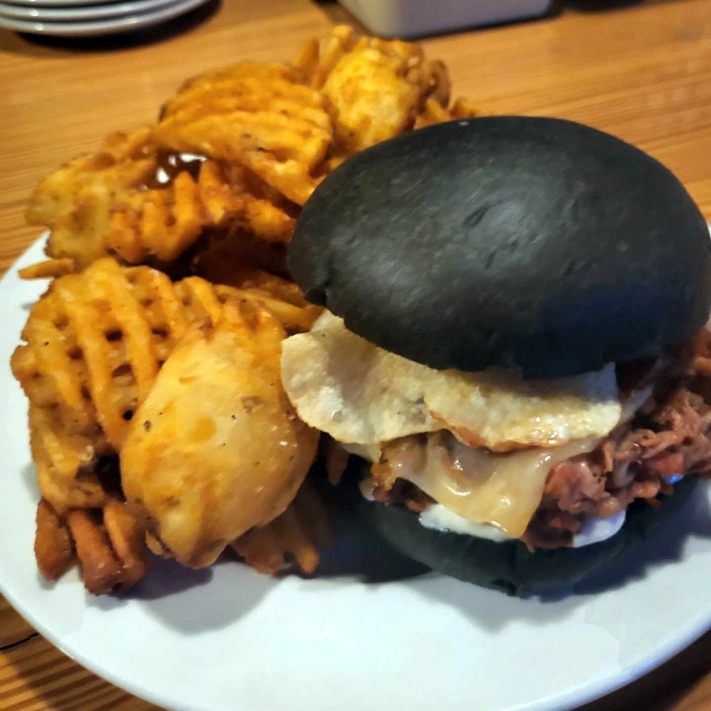 Eat Crow WEEKLY SPECIAL &bull; 🐖 The Porkocalypse ⚫: BBQ pulled pork on a black brioche bun with horseradish, Habanero cheese, and crunchy kettle chips. - $17, comes with a choice of side. - Available November 3-9.