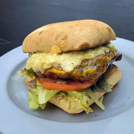 Eat Crow WEEKLY SPECIAL &bull;🍔 Philly Burger 🔔: Burger topped with onion, green peppers, chili oil, cream cheese, and garden on a brioche bun - $19, comes with a side. Available December 8-14.