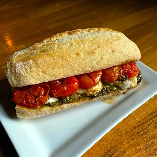 Eat Crow WEEKLY SPECIAL &bull;🍅 Roasted Tomato Sandwich 🥪: Roasted tomatoes with sliced mozzarella, pesto, and a balsamic glaze on a hoagie roll 🌿VEGETARIAN!🌿 - $19 comes with a side. Available January 5-11.