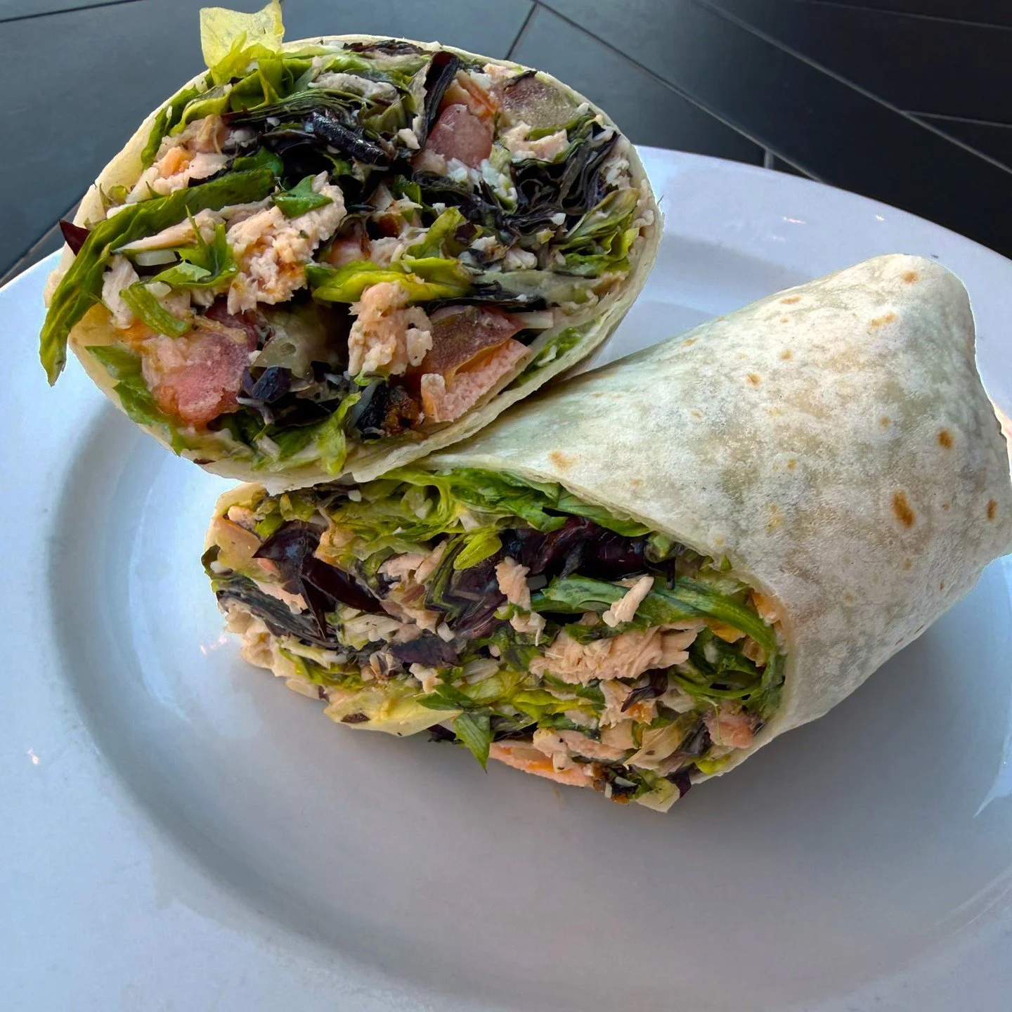 Eat Crow WEEKLY SPECIAL &bull;🌯Caesar wrap 🐟: Grilled salmon, mixed greens, diced tomatoes, shredded parmesan cheese, and Caesar dressing - $20 comes with a side. Available January 12-18.