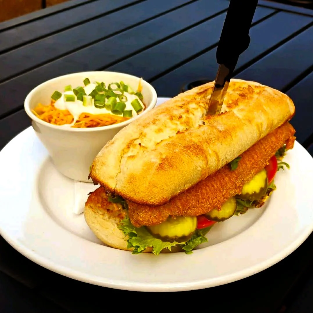 We are open! Eat Crow WEEKLY SPECIAL &bull;🥪 Fried Catfish Sandwich 🎣: Fried catfish filet on a hoagie with lettuce, tomato, onions, pickles, and garlic mayo - $198, comes with a side. Available January 26th - February 1st.