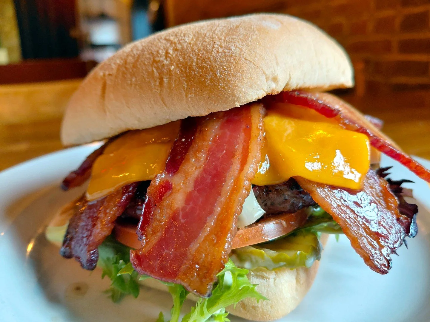 Come grab the Eat Crow WEEKLY SPECIAL &bull;🥓 Big Bacon Burger 🍔: Half-pound burger patty on a ciabatta bun, with garlic mayo, pickles, mixed greens, tomato slices, Swiss and cheddar cheese, and 4 strips of bacon - $20, comes with a choice of side.