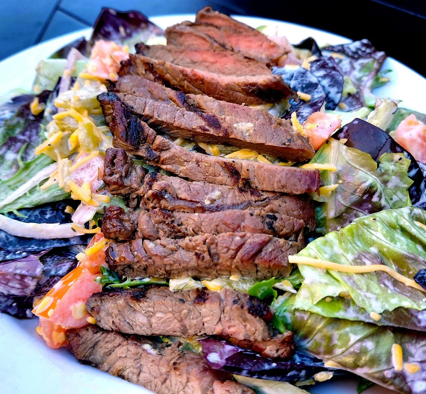 Eat Crow WEEKLY SPECIAL &bull;🥩 False Spring Steak Salad 🥗: Quarter-pound sirloin steak over a bed of mixed greens, tossed with house-made ranch, red onions, tomatoes, cheddar cheese, and green chilis - $19. Available March 9th - 15th