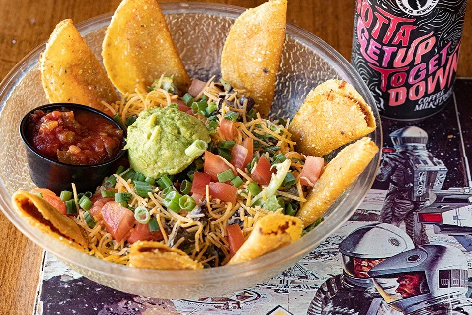 TACO SALAD: mixed greens, tomato, cheddar, green onion and fried mini chicken tacos with salsa, guacamole and avocado ranch. Order online for delivery or pickup: LINK IN BIO