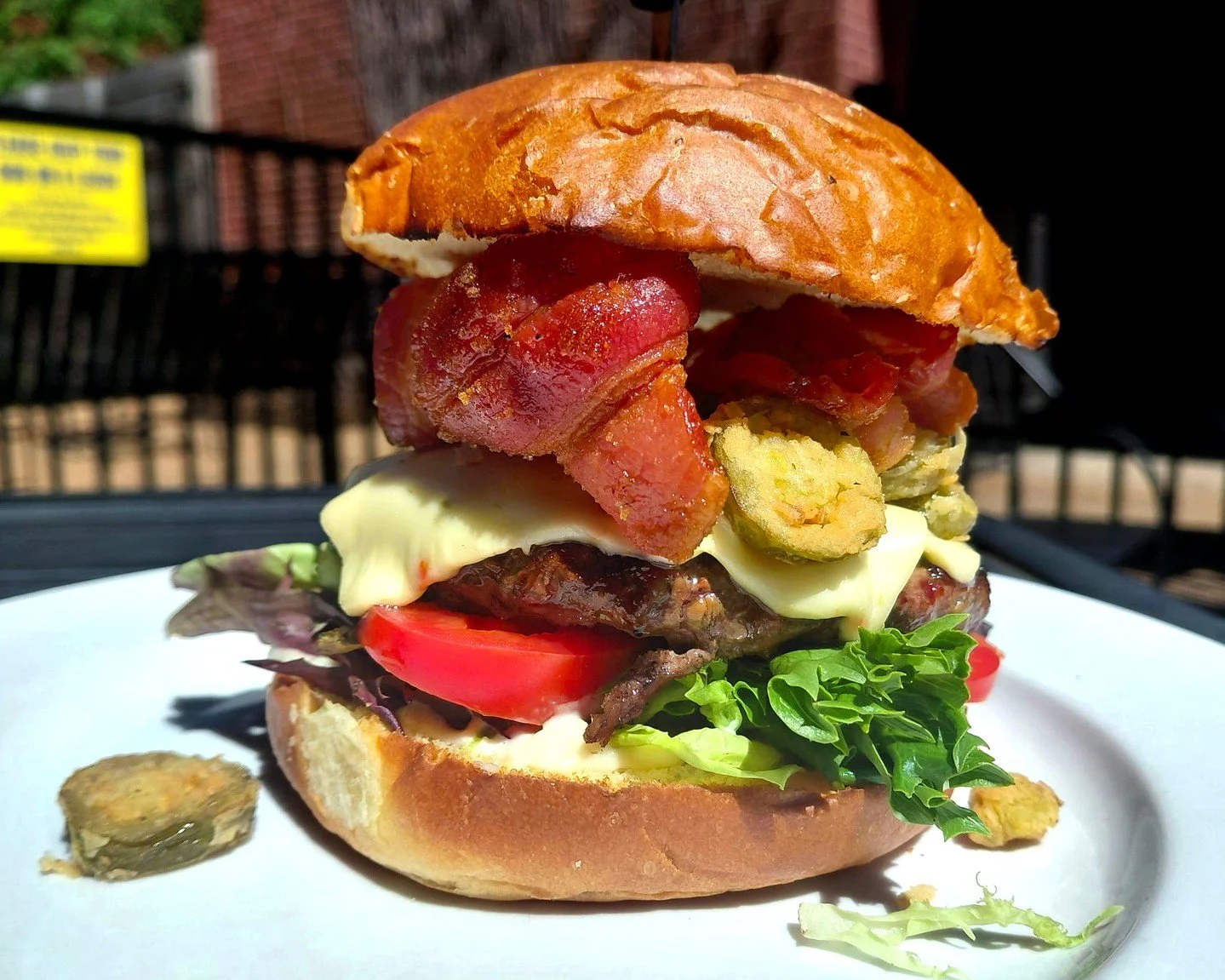 Eat Crow WEEKLY SPECIAL &bull; 🔥 Diablo Burger 🍔: Half-pound burger patty on a brioche bun with garlic mayonnaise, lettuce, tomato, double portion of pepper jack cheese, fried jalapenos, and brown sugar ghost pepper bacon - $20, includes a choice o