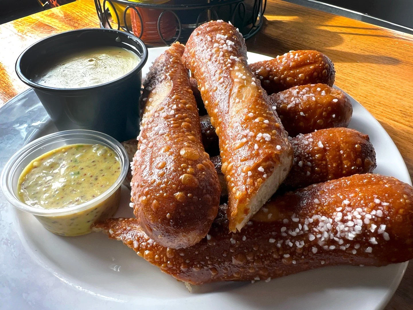 SOFT PRETZELS: deep-fried soft pretzel sticks served with maple dijon and gouda jalape&ntilde;o cheese sauce for dipping!