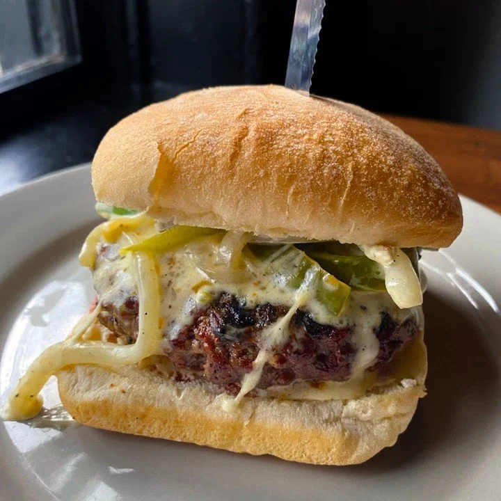 Eat Crow WEEKLY SPECIAL &bull; 🔥 The Cajun Philly Burger 🍔: A half-pound burger seasoned with Cajun spices, served on a ciabatta bun with a cream cheese spread, saut&eacute;ed onions, and peppers. This includes a choice of side and is available fro
