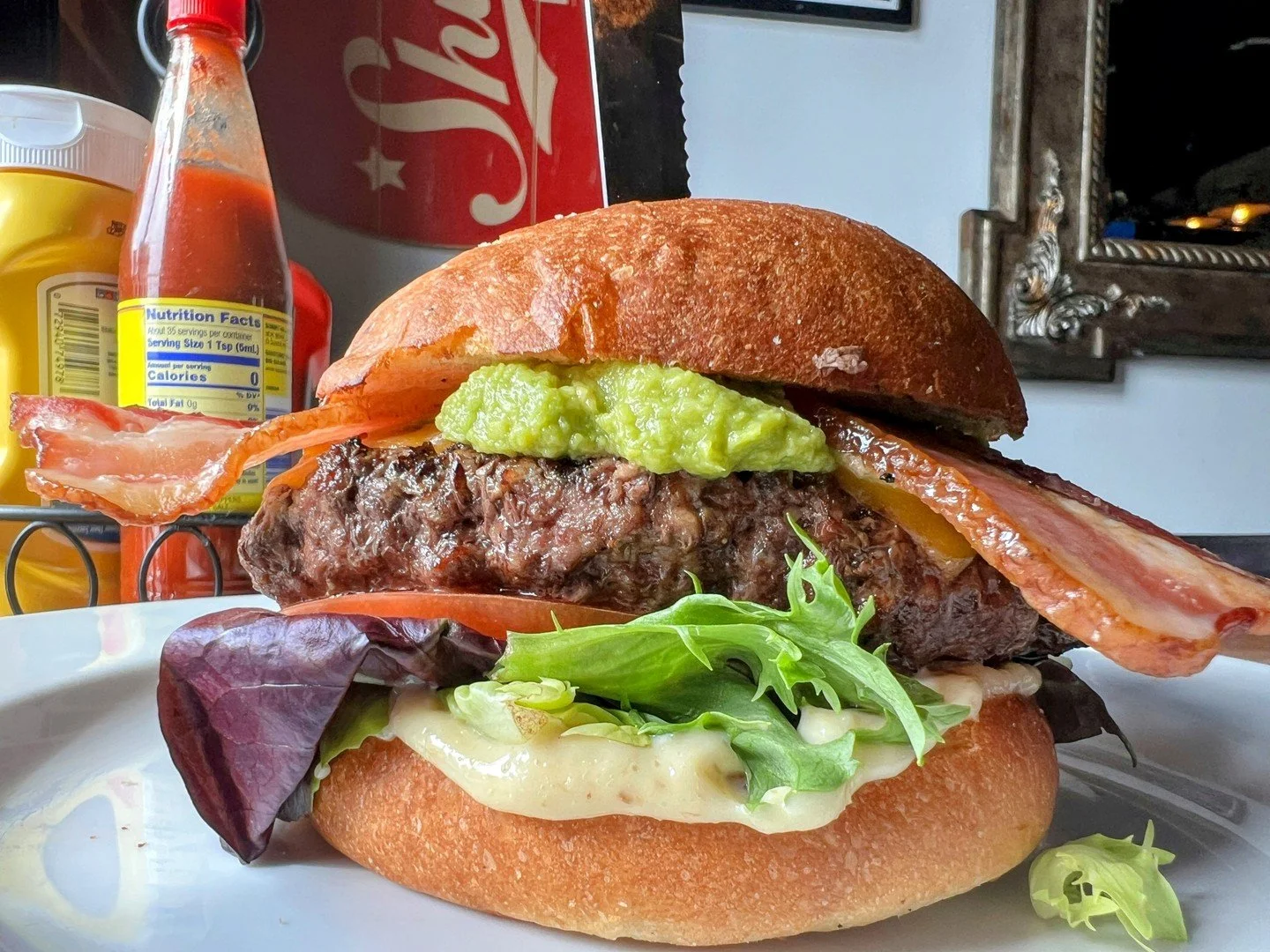 B.A. BARACUS: choice of half-pound beef or Hungry Planet veggie patty with mixed greens, tomato, bacon, avocado, cheddar, and deep-fried garlic mayo on a brioche bun. It comes with a choice of sides!!

#EatCrowSTL #Soulard #STLFood #STLEats #STLResta
