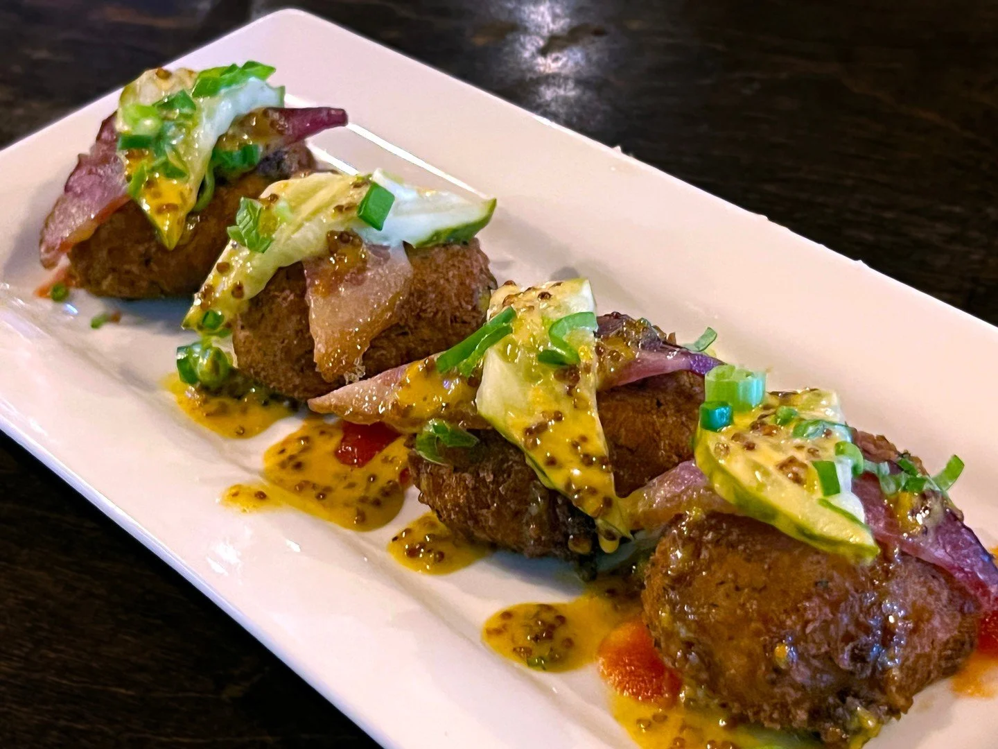 DEEP-FRIED DEVILED EGGS topped with bacon and pickles, garnished with house-made tomato jam and maple Dijon. 
**🌿 CAN BE MADE VEGETARIAN! 🌿** 

#EatCrowSTL #SoulardEats #StLouisFood #DeviledEggs #ComfortFood #BarFood #VegetarianFriendly