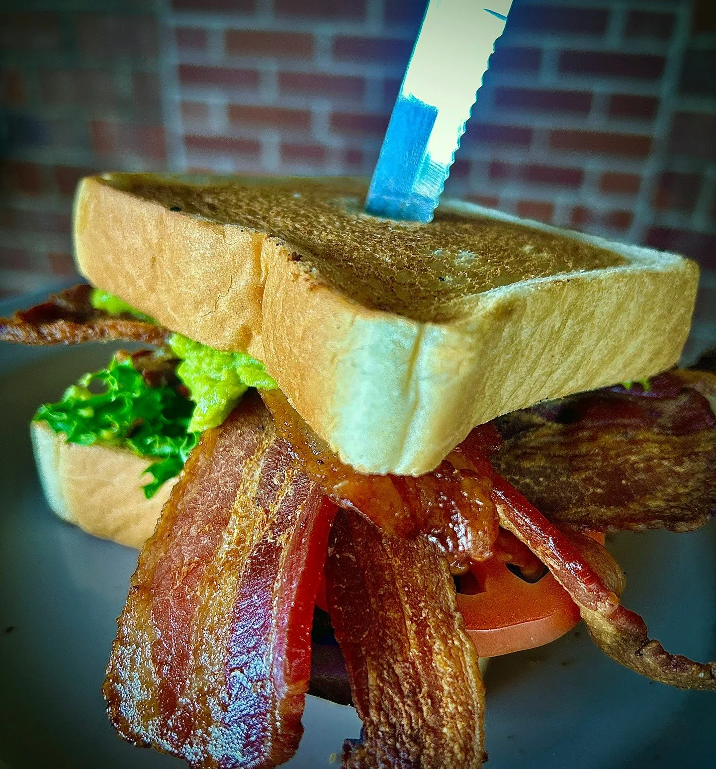 BLAT: piled high with bacon, mixed greens, tomatoes, avocado, and garlic-pepper mayo, served on Texas toast -  can sub with veggie bacon! 🌿 

#EatCrowSTL #SoulardEats #StLouisFood #StLouisRestaurants #BLAT #ComfortFood #NeighborhoodBar #VeggieBacon