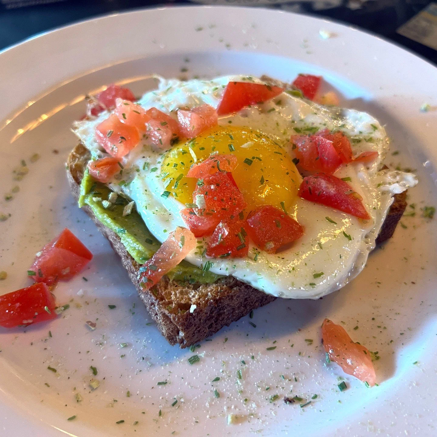 Saturday METAL BRUNCH in Soulard 11 am-2 pm!! AVOCADO TOAST: toast topped with avocado, diced tomatoes, and a sunny-side-up egg, garnished with Fox Point seasoning.