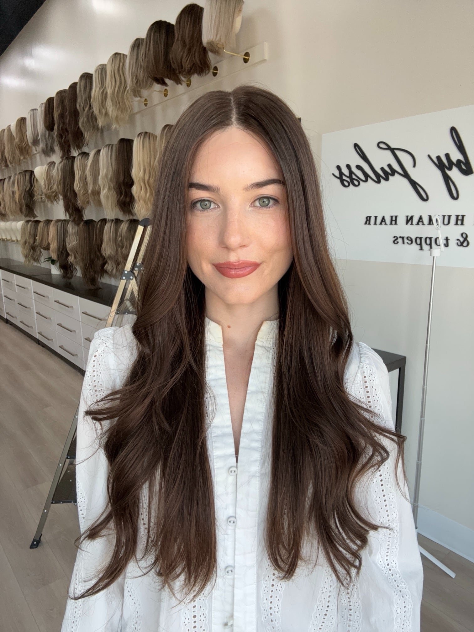 _Elegant_brunette_wig_with_natural_highlights__styled_on_a_woman_in_Sacramento_Studio___.jpg