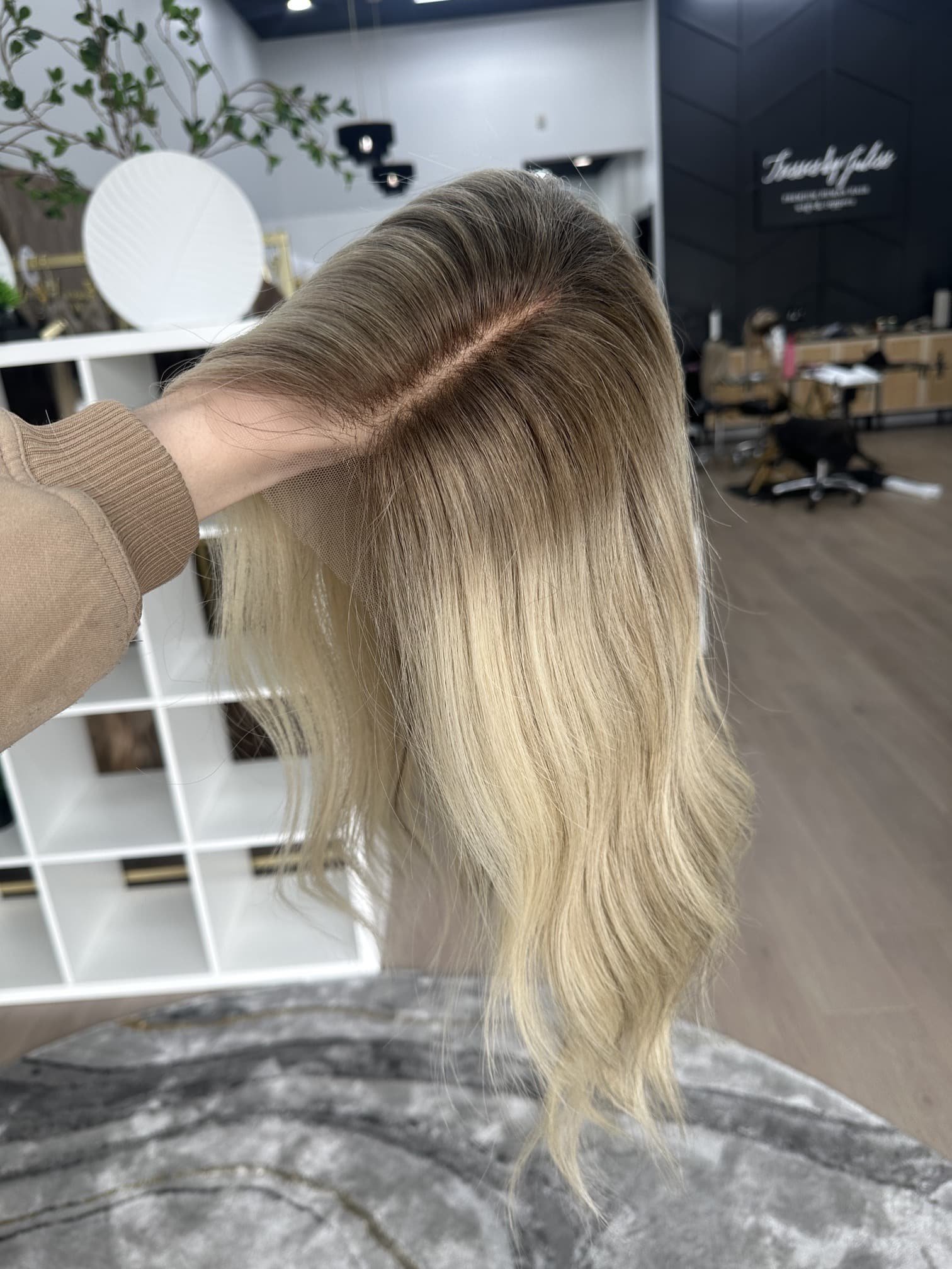 _Model_wearing_a_custom_made_wig_at_the_Folsom_Tresses_By_Juless_Studio__designed_to_empower_women_facing_hair_loss___.jpg