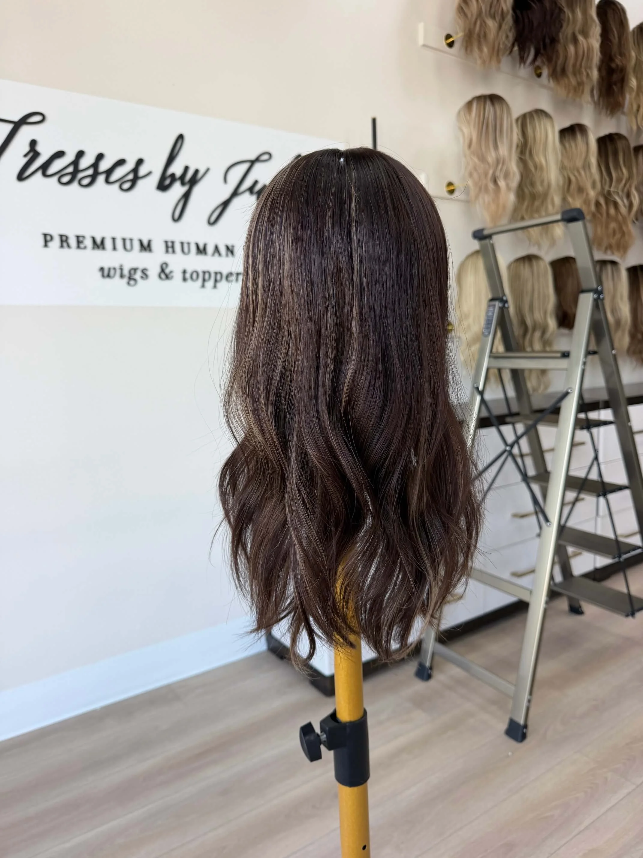 18-inch brown human hair topper with a Feather Silque base