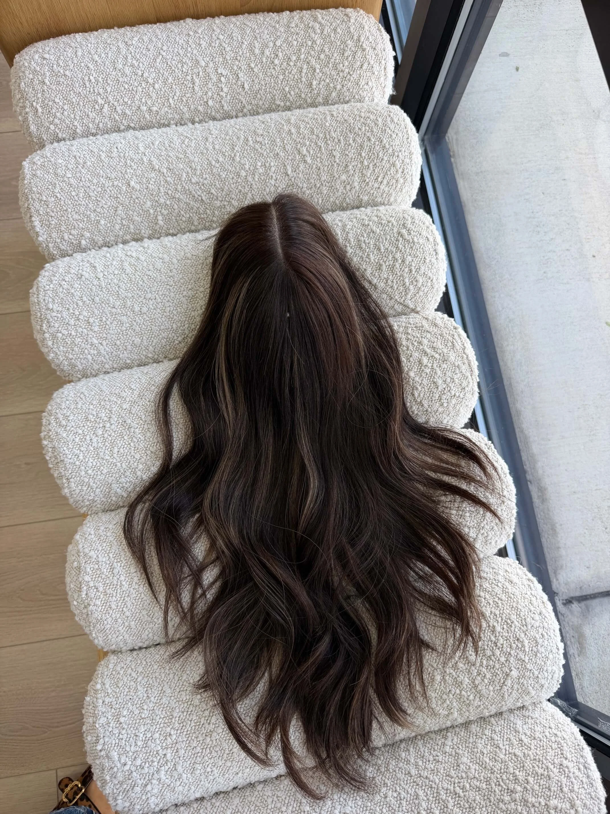 18-inch brown human hair topper with a Feather Silque base