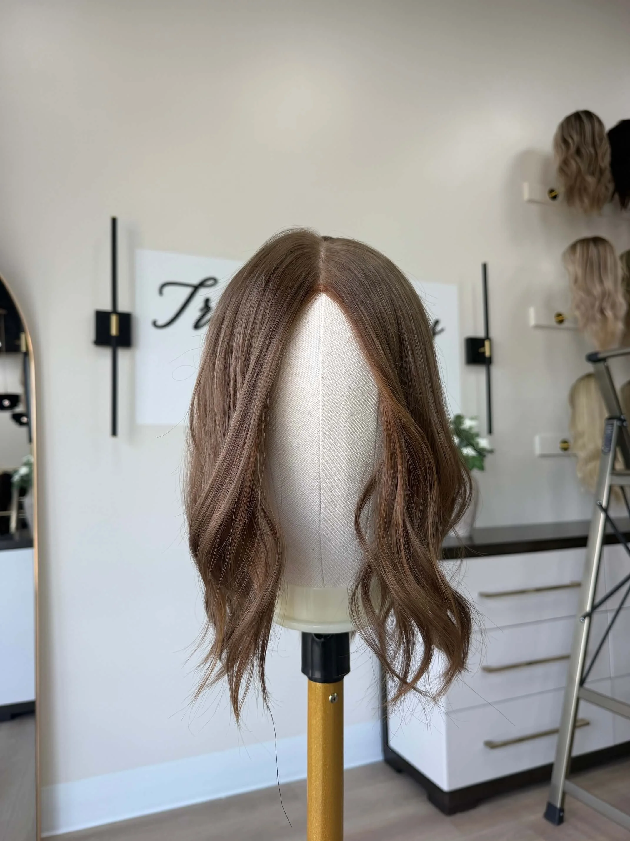 18-inch brown human hair topper with a Feather Silque base