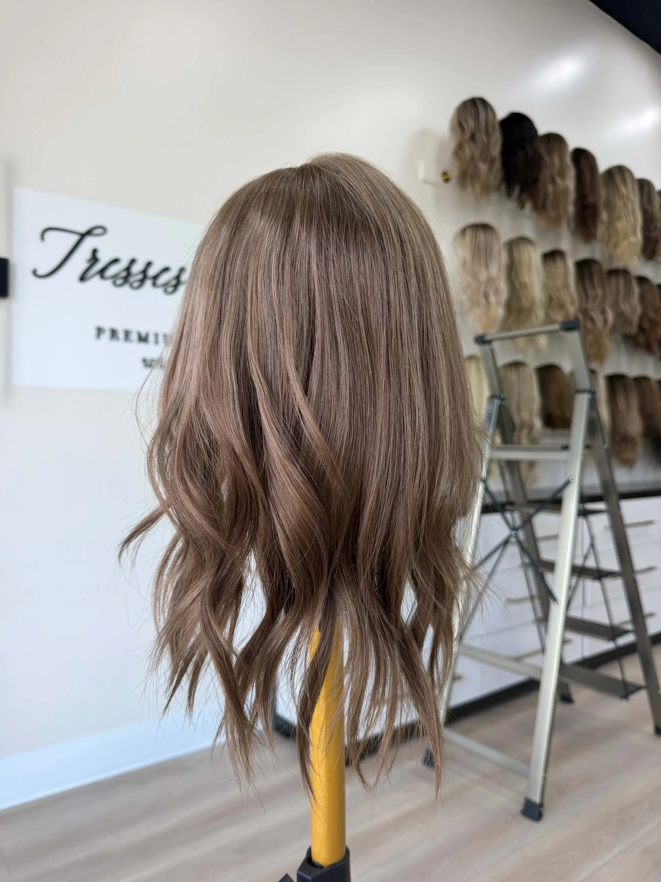 18-inch brown human hair topper with a Feather Silque base