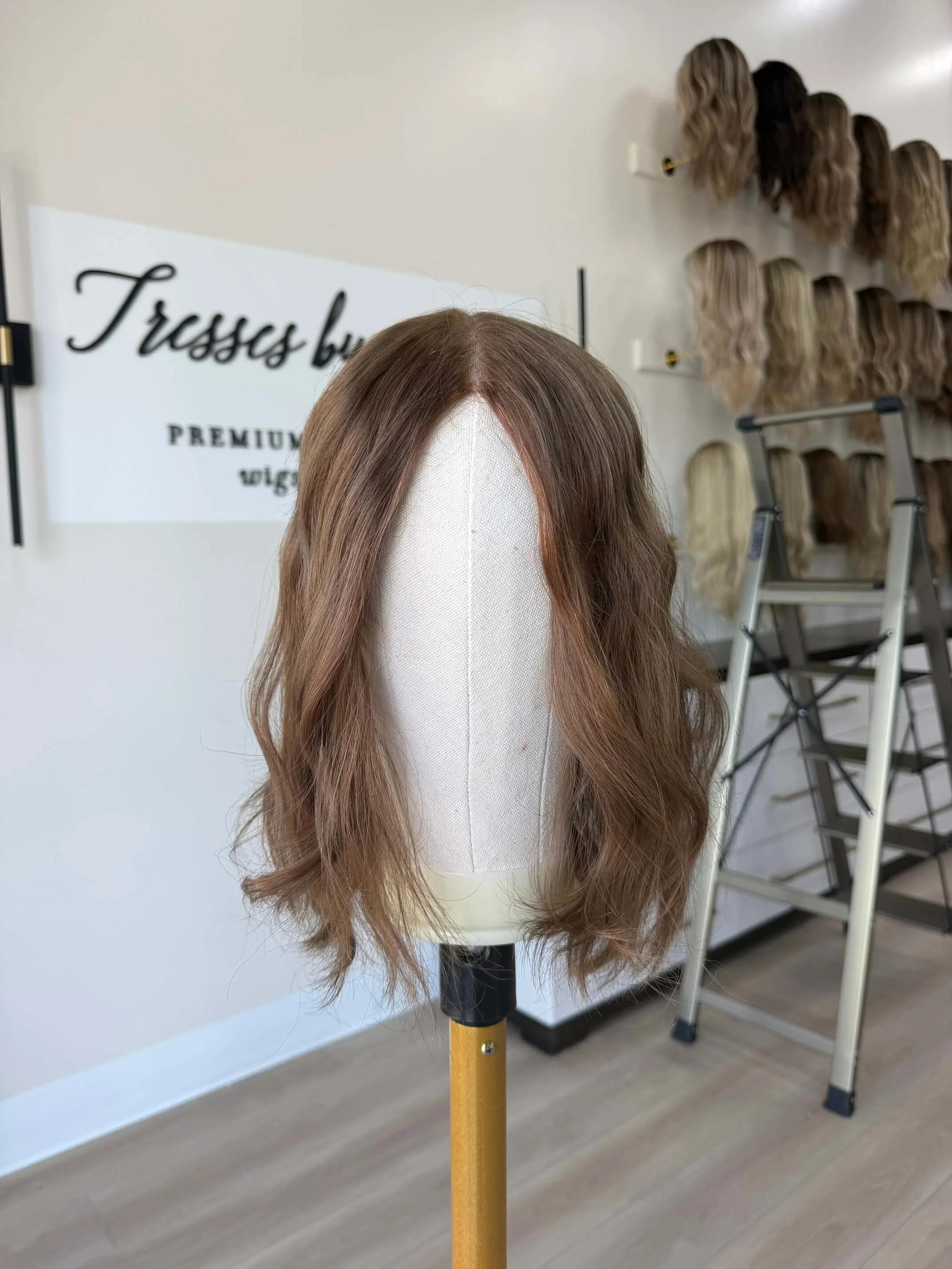 24-inch brown human hair wig with a Feather Silque base