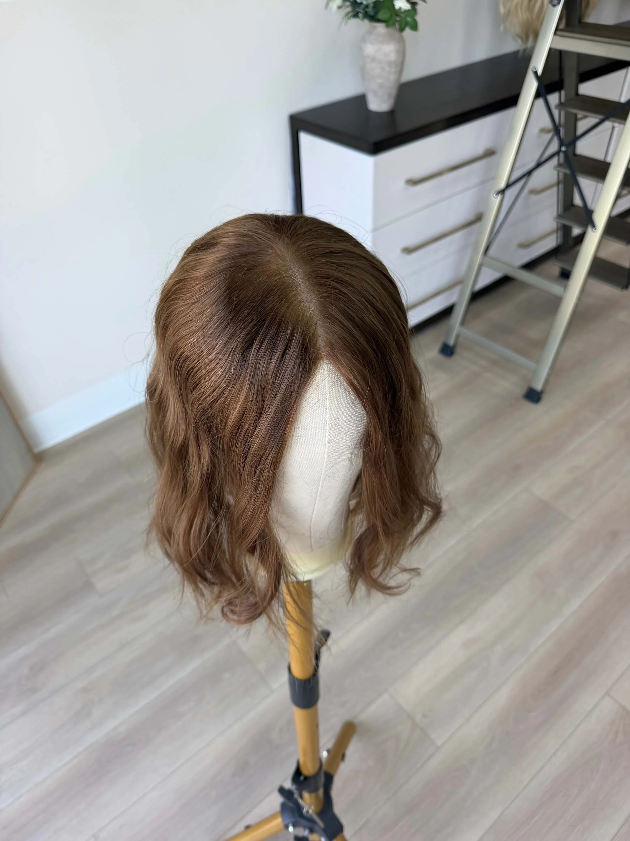 24-inch brown human hair wig with a Feather Silque base