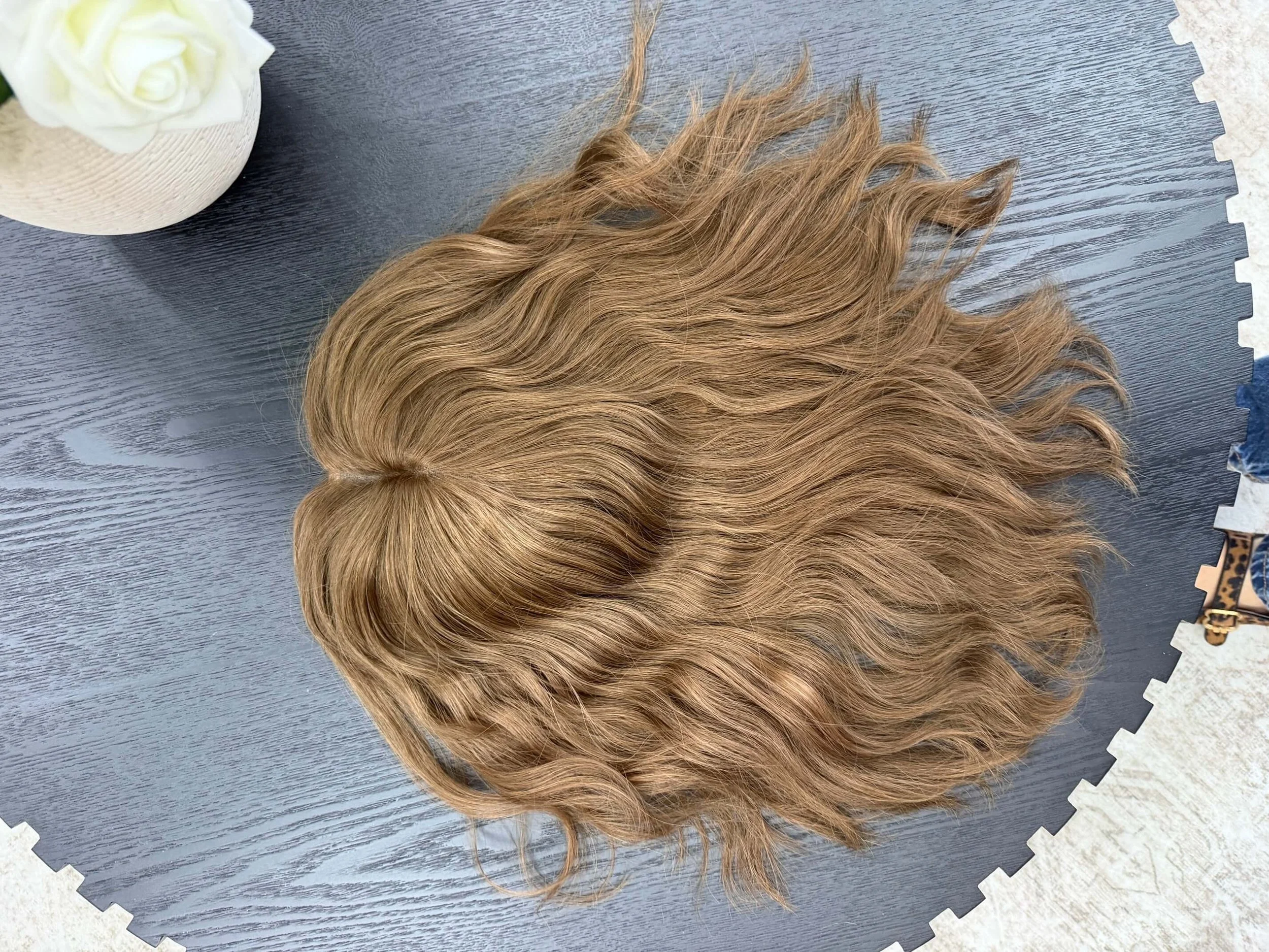 24-inch brown human hair wig with a Feather Silque base