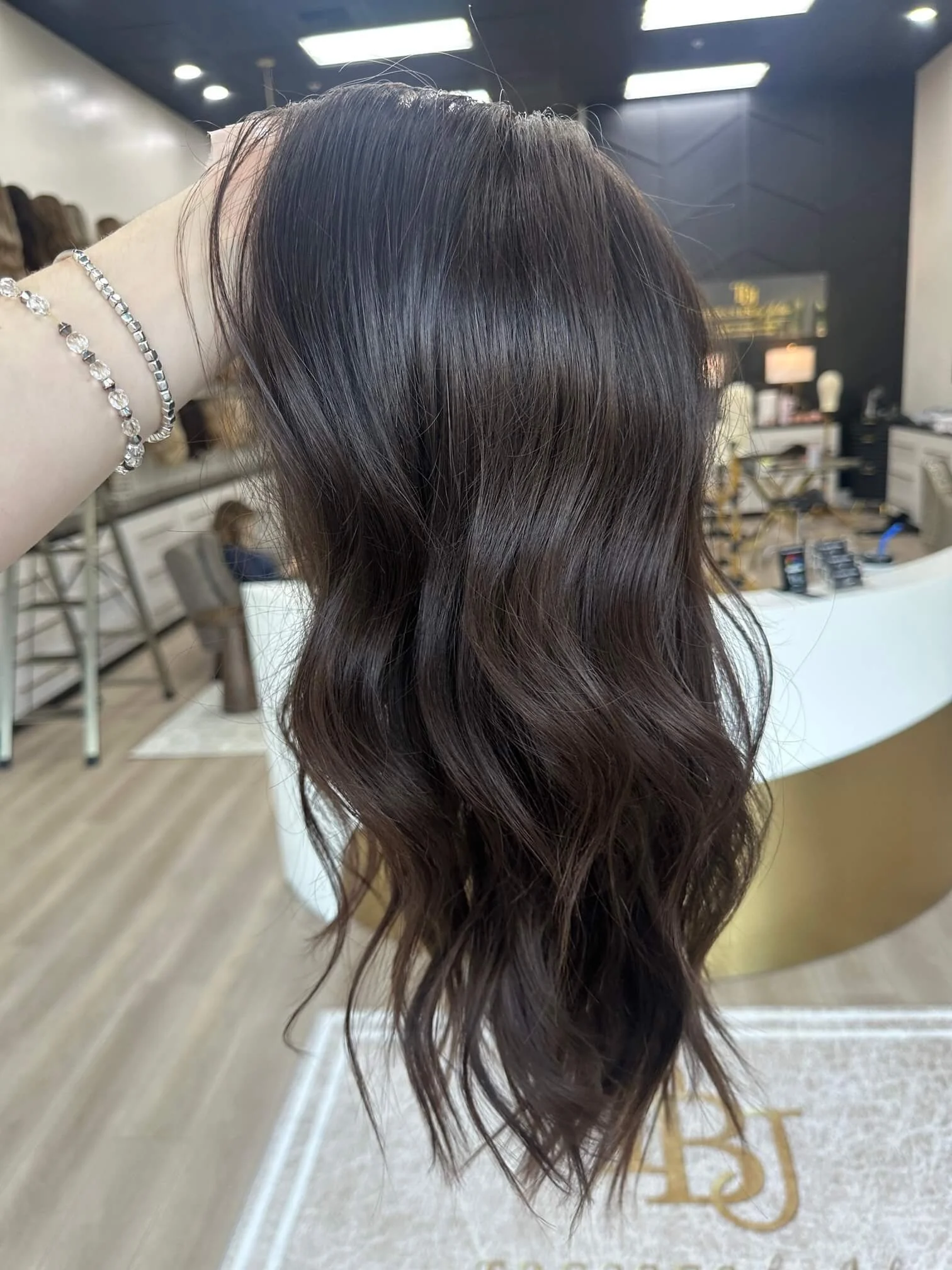 23-inch brown Slavic human hair topper with a Diamond Lace Top base