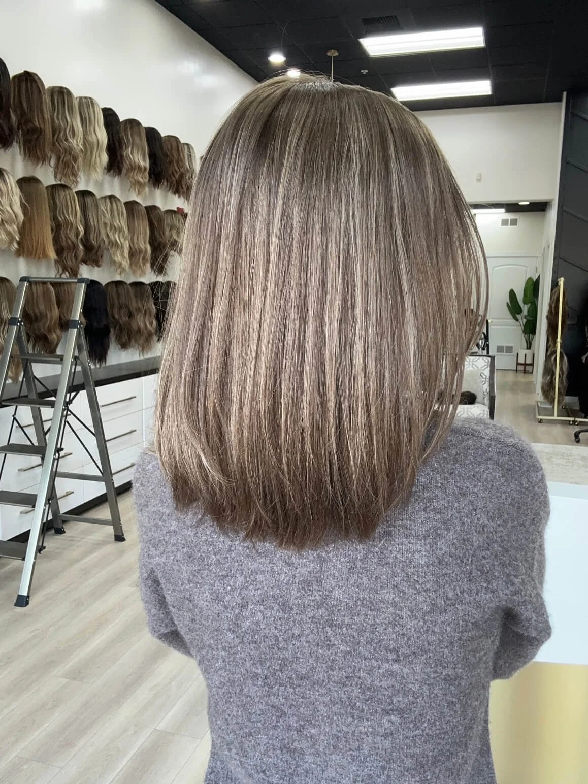 18-inch bronde human hair wig with a Feather Silque base
