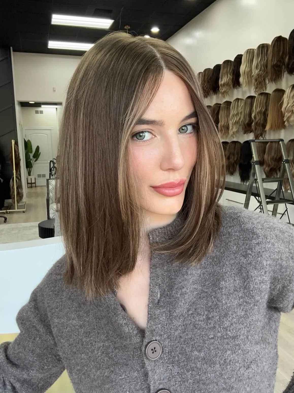 18-inch bronde human hair wig with a Feather Silque base