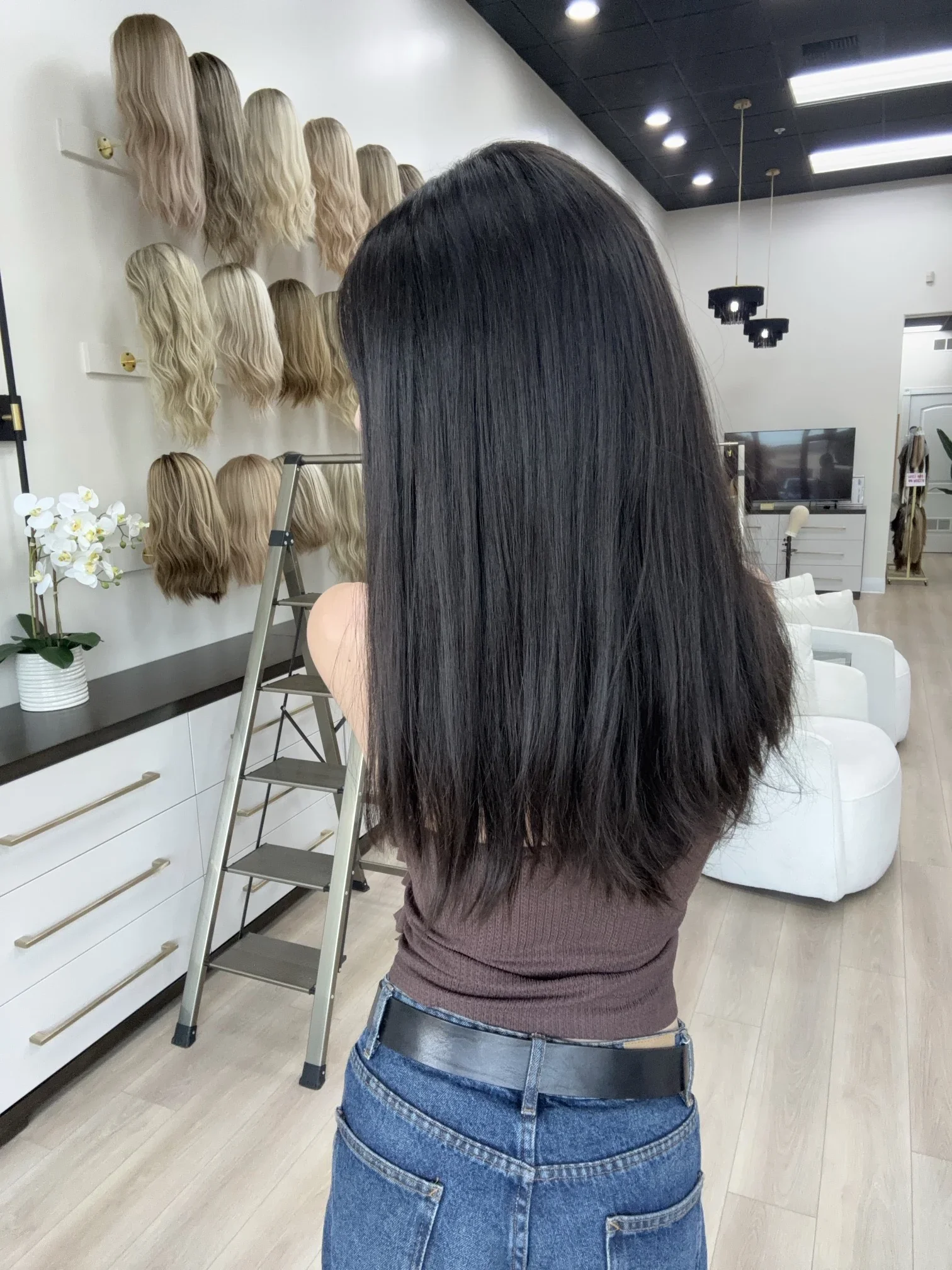 _Jet_black_human_hair_wig_with_soft_curls_on_a_woman_in_Folsom_Studio__California___.webp