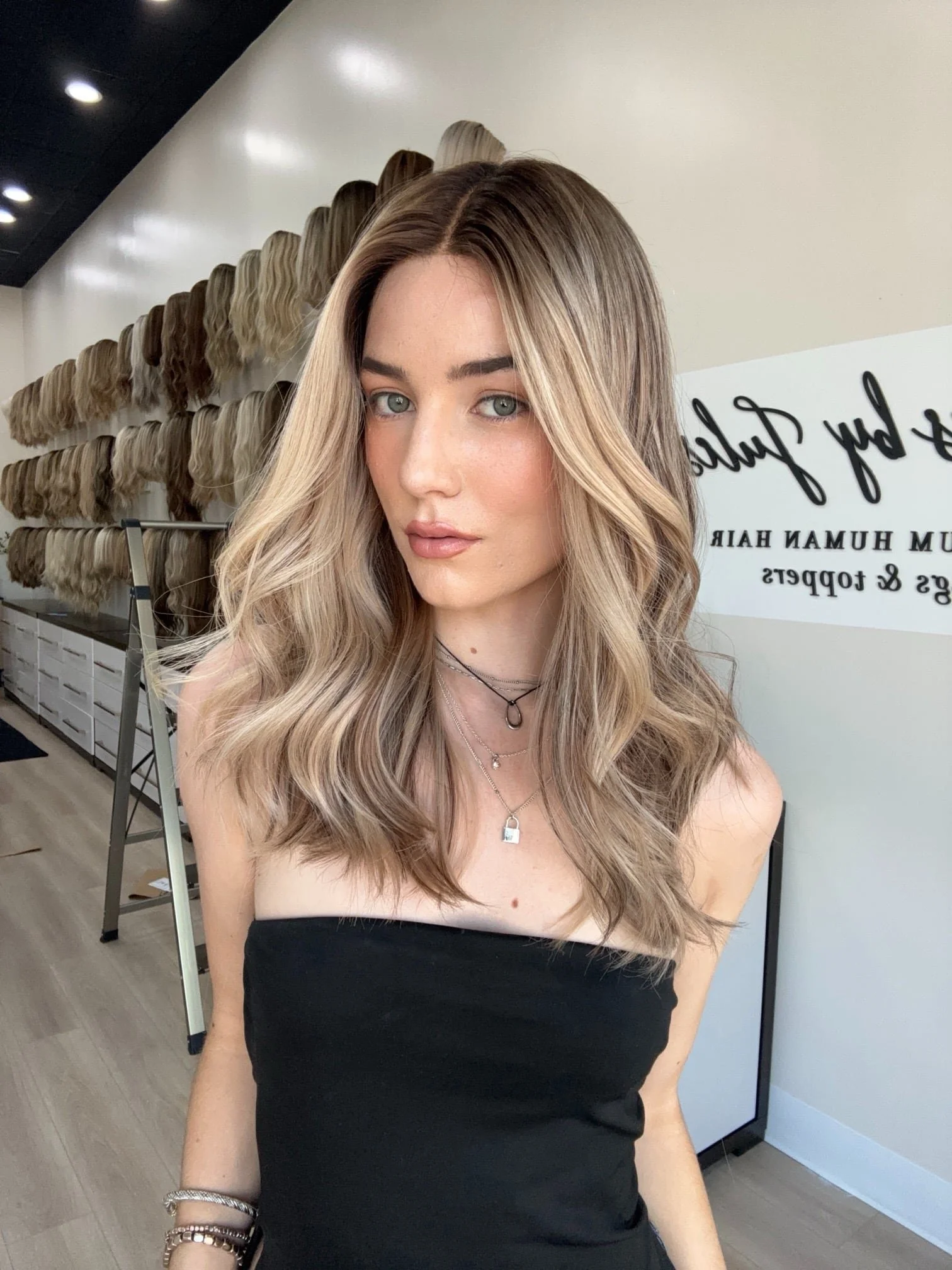 Brunette_human_hair_wig_with_caramel_highlights_worn_by_a_woman_in_Folsom_Studio__.jpg