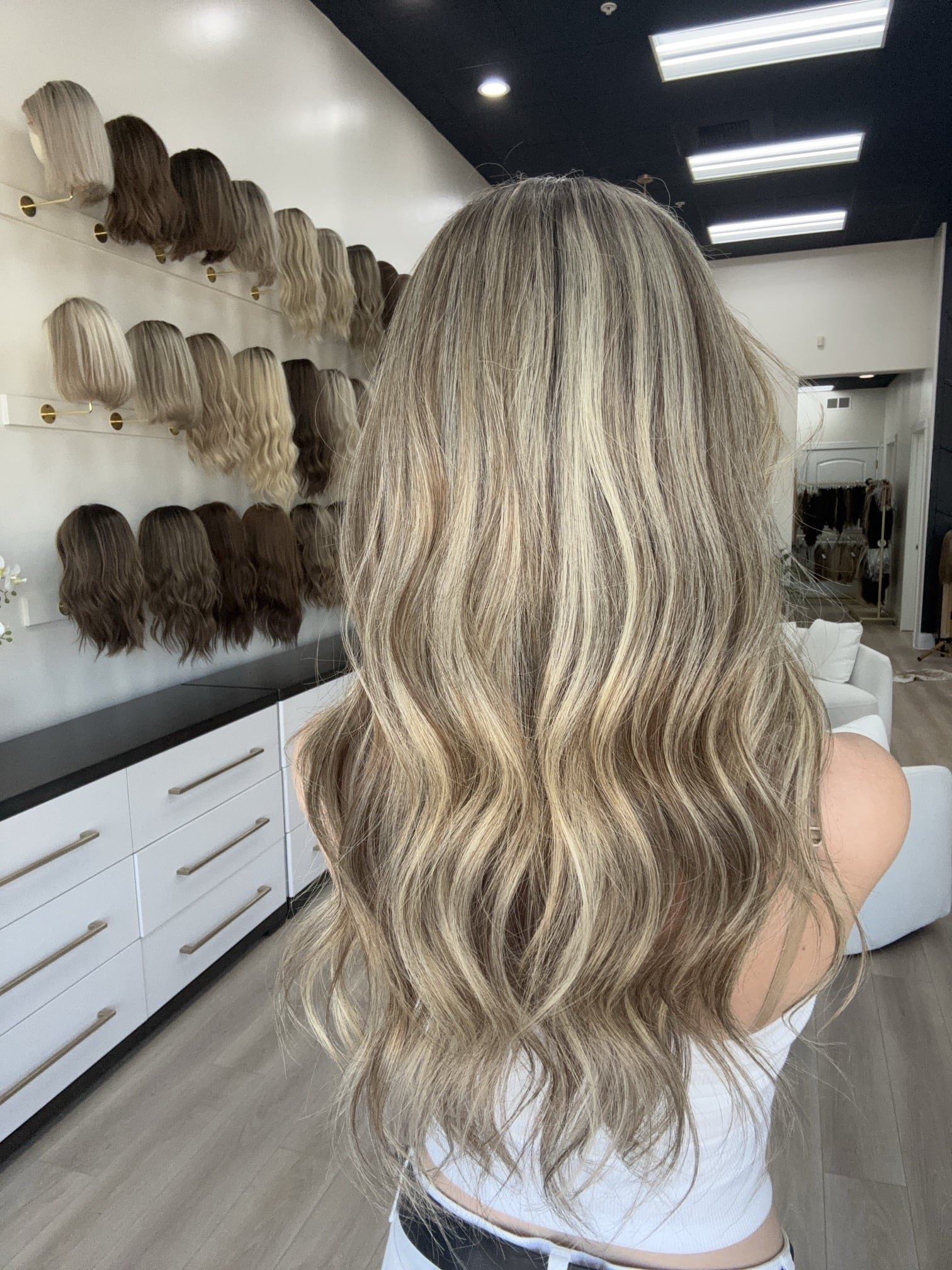 Brunette_human_hair_wig_with_caramel_highlights_worn_by_a_woman_in_Folsom_Studio__.jpg