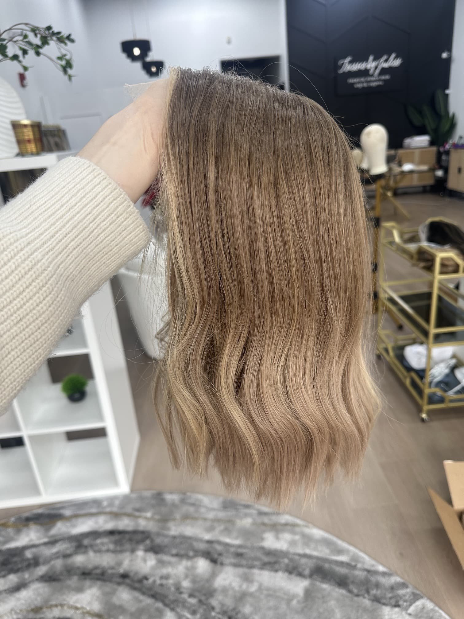 _Deep_red_wavy_wig_worn_by_a_woman_inside_Tresses_By_Juless_Studio__Citrus_Heights__Folsom___.jpg