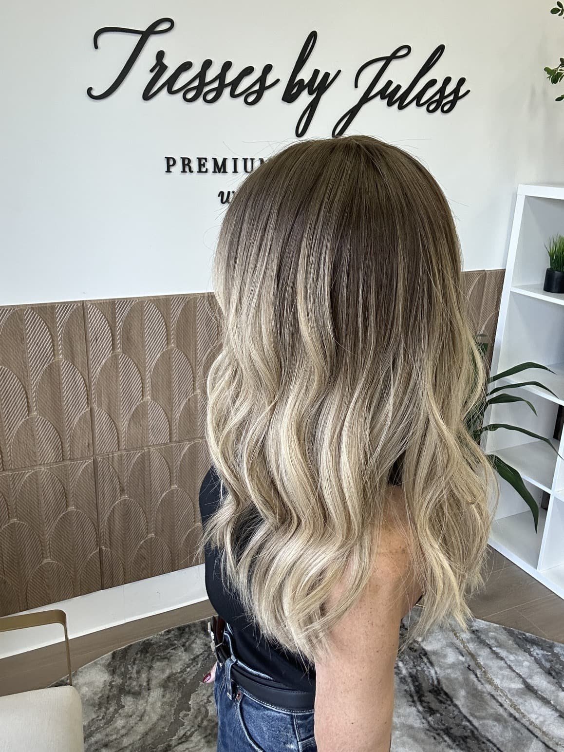 _Elegant_brunette_wig_with_natural_highlights__styled_on_a_woman_in_Sacramento_Studio___.jpg