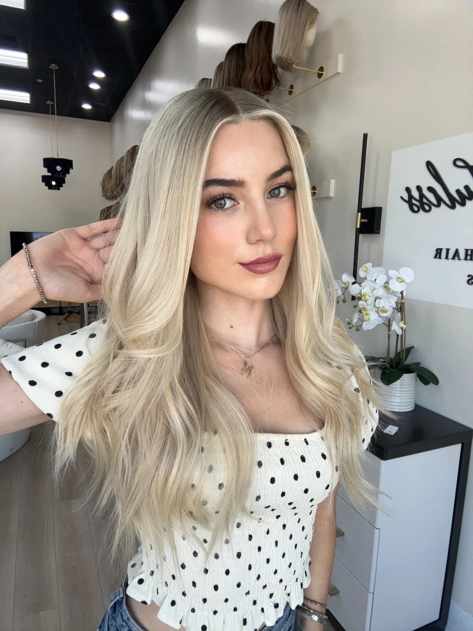 _Curly_jet_black_wig_styled_on_a_woman_at_Tresses_By_Juless_Studio__Sacramento___.jpg