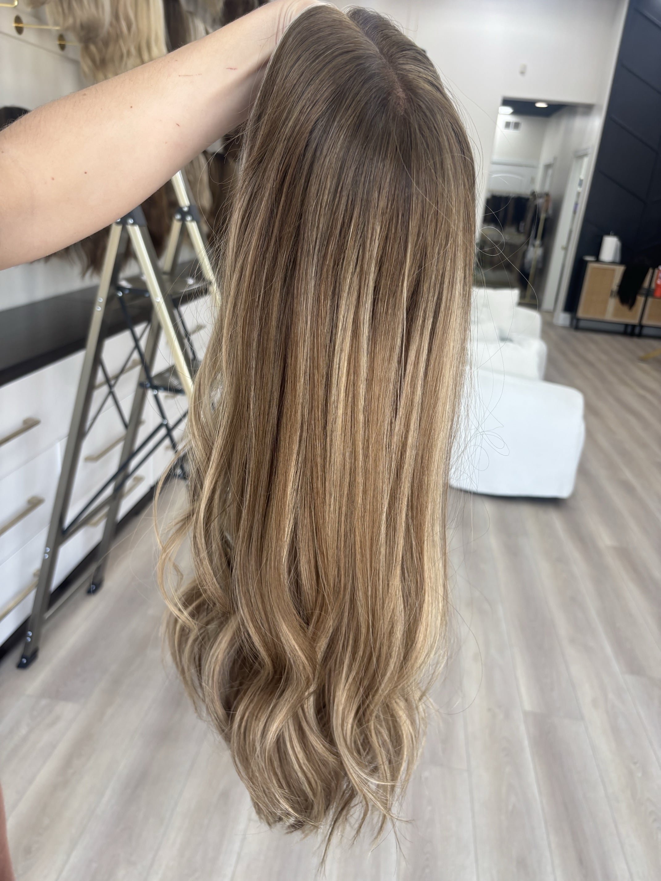 Brunette_human_hair_wig_with_caramel_highlights_worn_by_a_woman_in_Folsom_Studio__.jpg