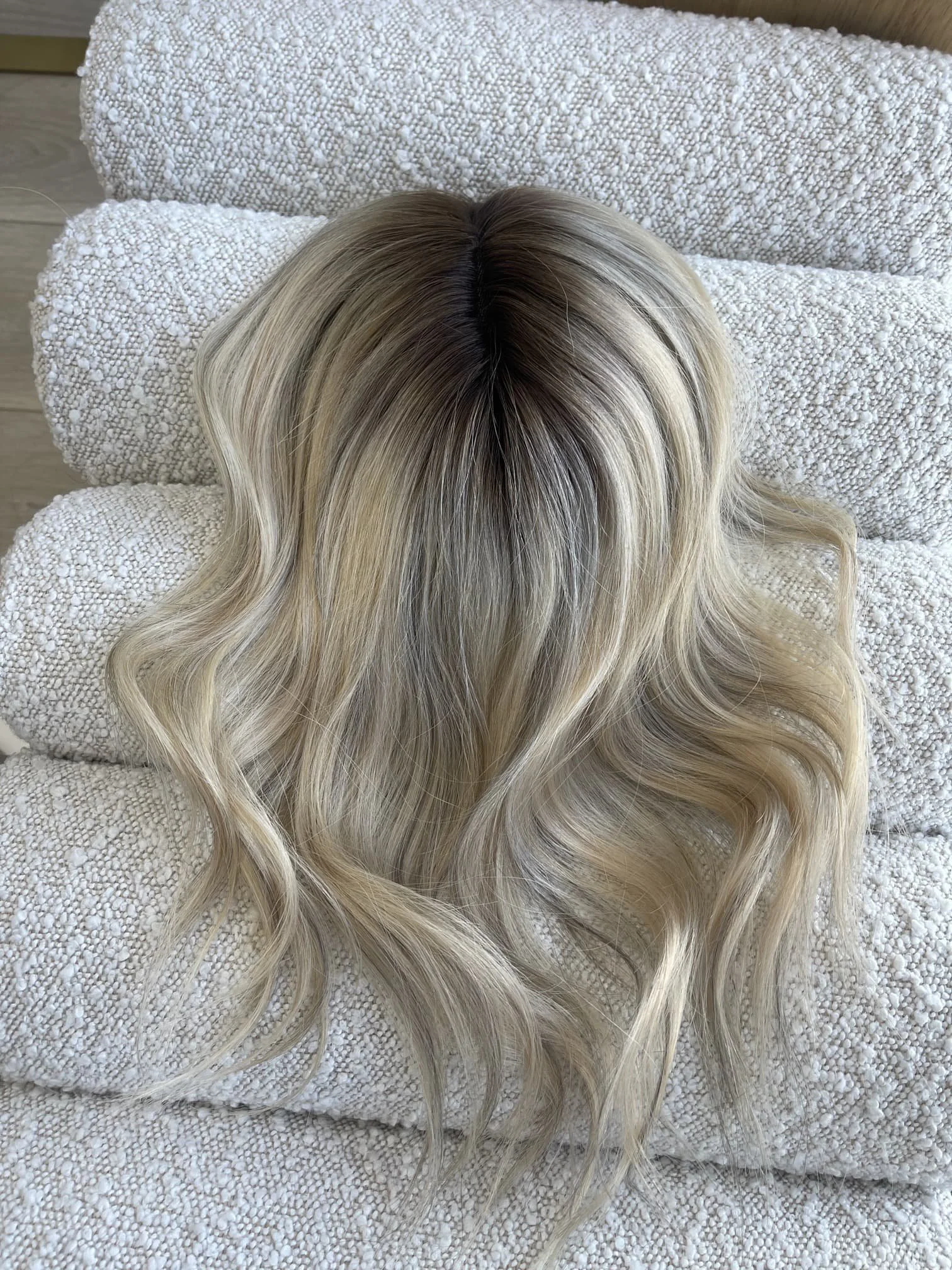 _Elegant_brunette_wig_with_natural_highlights__styled_on_a_woman_in_Sacramento_Studio___.jpg