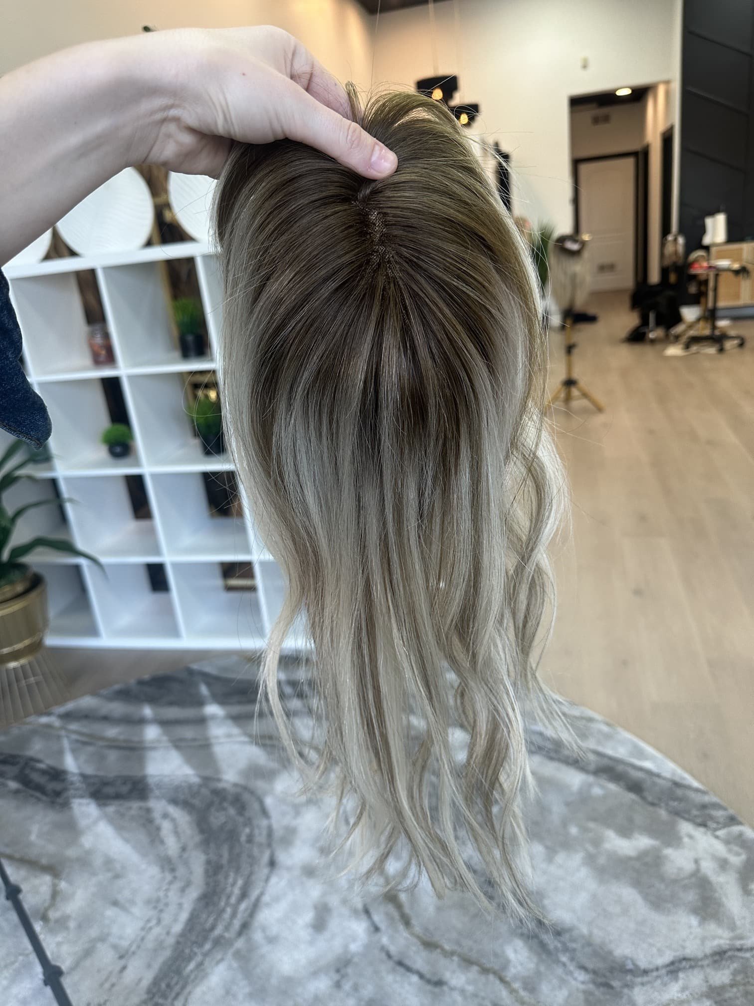 _Elegant_brunette_wig_with_natural_highlights__styled_on_a_woman_in_Sacramento_Studio___.jpg